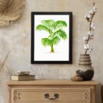 Elegant palm plant with detailed green leaves and light brown trunk, framed in black, perfect for nature-inspired vintage wall art. displayed on the wall