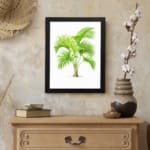 Vintage wall art featuring a green palm plant with curved leaves, framed in black, adds a fresh tropical feel to any room. displayed on the wall