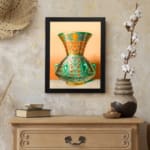 Vintage wall art featuring a decorative green vase with floral and geometric patterns, framed in black. displayed on the wall