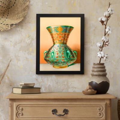 Vintage wall art featuring a decorative green vase with floral and geometric patterns, framed in black. displayed on the wall