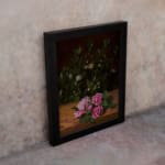 Infidu vintage wall art featuring delicate pink roses with lush green leaves on a rustic wooden background. displayed on the wall art in a black frame