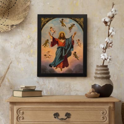 Vintage wall art of Jesus Christ ascending with angels in a soft sky, framed in black with golden accents. displayed on the wall
