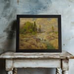 Vintage wall art of a rocky stream with green trees and a cloudy sky in warm earthy tones of brown, green, and yellow. displayed on the wall