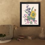 Infidu vintage wall art featuring a vibrant sunflower with soft blue and pink flowers, green leaves, and a delicate butterfly. displayed on the wall art in a black frame