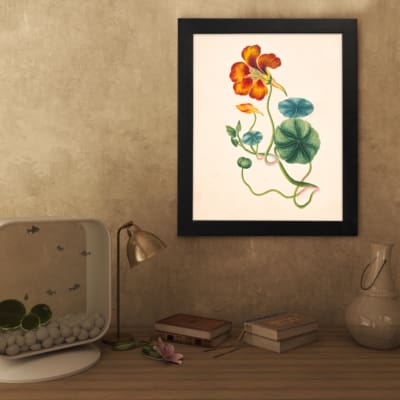 Vintage floral wall art with orange-red flower and green twisting vines on a beige background. displayed on the wall