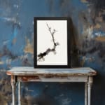 Minimal blossom branch vintage wall art in black and light brown on white background. displayed on the wall