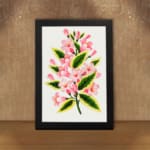 Infidu vintage wall art with soft pink flowers and green leaves. displayed on the wall