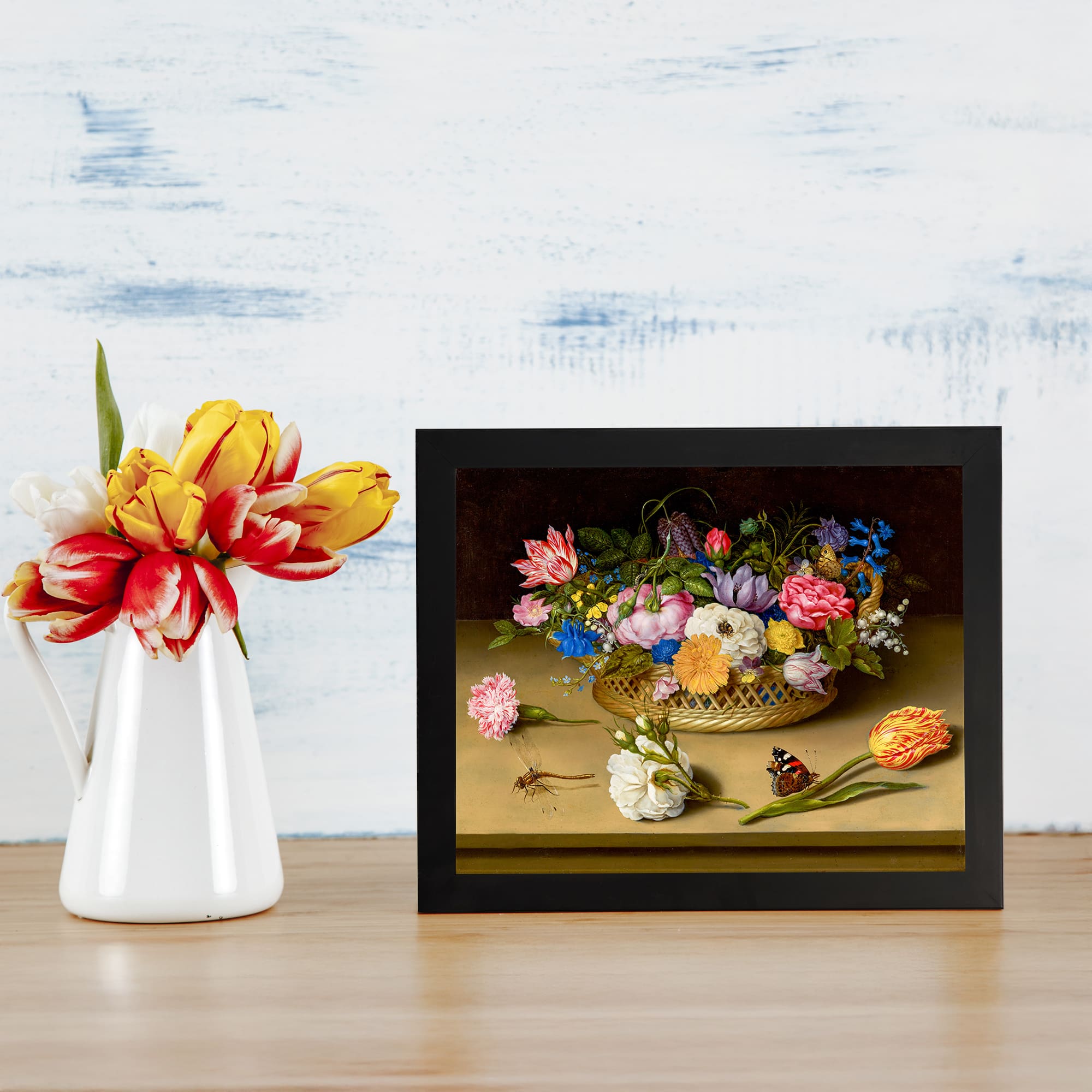 Vintage floral basket wall art with bright flowers and insects on a dark background. displayed on the wall