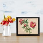 Infidu vintage wall art of blooming pink flowers with green leaves on a warm beige background. displayed on the wall