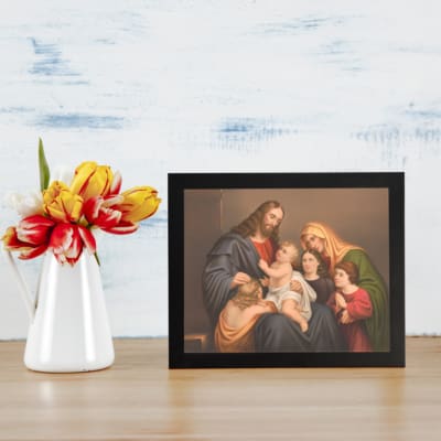 Vintage wall art of Jesus, Mary, and children in a peaceful religious family scene with warm tones and classic style. displayed on the wall