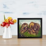 Vintage wall art of a lion family relaxing in a grassy field with earthy tones and a calm, natural background. displayed on the wall