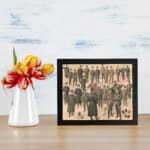 Vintage wall art print featuring classic men’s fashion in suits and hats with a soft beige background. displayed on the wall