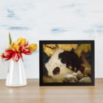 Vintage wall art of mother bear and cubs walking through snowy forest in warm earthy tones. displayed on the wall