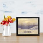 Serene winter landscape with snowy trees and soft sky in vintage art style. displayed on the wall