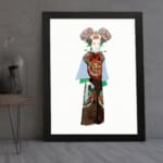 Vintage wall art of a person in traditional clothing with colorful robe and detailed headpiece, framed in black. displayed on the wall