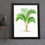 Vintage wall art of a green palm with long leaves and a split trunk framed in black. displayed on the wall
