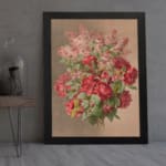 Vintage wall art of red roses and pink flowers with green leaves on a beige background, framed in black. displayed on the wall