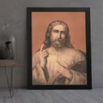 Vintage wall art of Jesus Christ holding a book, raising one hand, with soft, muted colors and a warm terracotta background. displayed on the wall