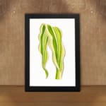 Vintage wall art of a single leaf with flowing, wavy shapes in green and yellow, framed in black on a white background. displayed on the wall