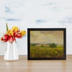 Infidu vintage countryside wall art with rolling hills and open fields in warm, earthy tones. displayed on the wall