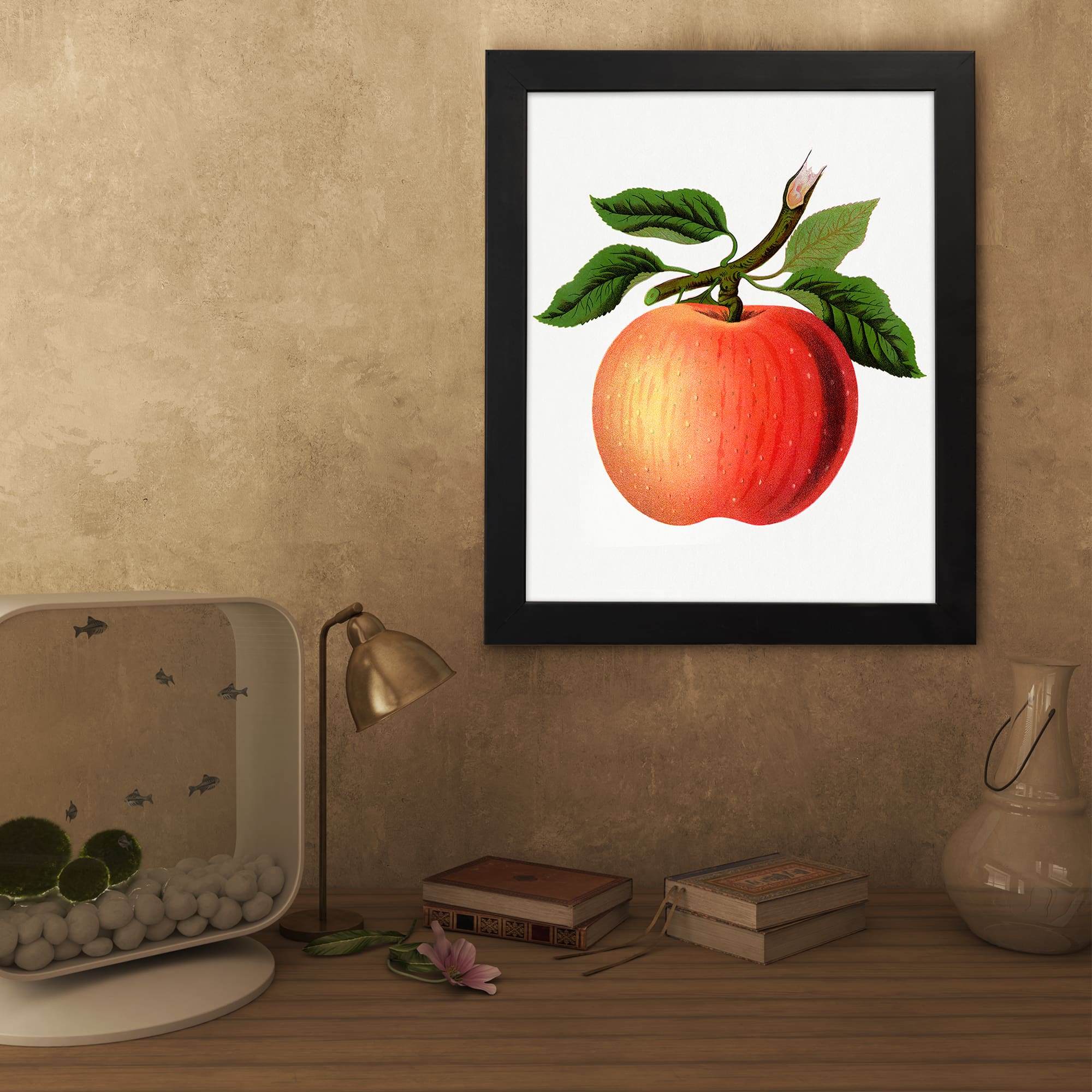 Vintage wall art of a ripe apple with green leaves on a white background, framed in black. displayed on the wall