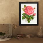 Vintage pink rose in full bloom with green leaves on a white background. displayed on the wall