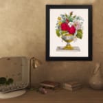 Infidu vintage wall art featuring a colorful floral arrangement in an elegant vase against a white background. displayed on the wall art in a black frame