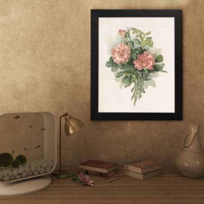 Infidu vintage pink floral wall art with two pink flowers and green leaves on a beige background in a black frame. displayed on the wall