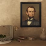 Infidu vintage wall decor featuring a classic portrait of a man with soft, earthy tones and a timeless appeal. displayed on the wall art in a black frame