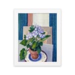Vintage wall art with potted purple flowers and terracotta pot on a blue and white plate, set against a soft geometric background. hung on the wall
