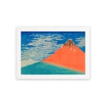 Vintage wall art of Mount Fuji by Hokusai with red mountain, blue sky, and white clouds. hung on the wall