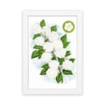 Infidu vintage wall art featuring delicate white flowers and vibrant green leaves against a white background hung on the wall on a white background