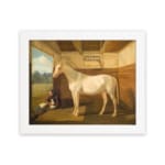 Vintage wall art of a white horse standing calmly inside a rustic wooden stable with a peaceful countryside view. hung on the wall