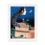 The vintage wall art features a ghostly face with long black hair emerging from a wooden barrel, set against a dramatic night sky background. hung on the wall