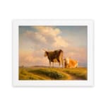 Vintage wall art showing two cows in a grassy field beneath a warm, glowing sky with rolling hills in the background. hung on the wall