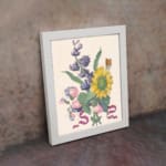Infidu vintage wall art featuring a vibrant sunflower with soft blue and pink flowers, green leaves, and a delicate butterfly. displayed on the wall art in a white frame