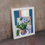 Vintage wall art with potted purple flowers and terracotta pot on a blue and white plate, set against a soft geometric background. displayed on the wall