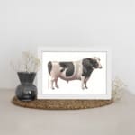 Vintage black and white cow wall art in clean, minimalist style with white background. displayed on the wall