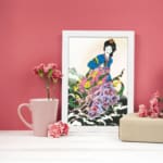 Elegant East Asian woman in floral attire with soft botanical background in vintage wall art print. displayed on the wall