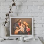 Vintage wall art of Jesus, Mary, and children in a peaceful religious family scene with warm tones and classic style. displayed on the wall