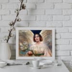 Infidu Serene Angelic Woman vintage wall art print showing a peaceful woman in a white gown with flowers and glowing background. displayed on the wall