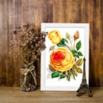 Infidu Vintage Yellow Rose Botanical Wall Art with vibrant yellow roses and green leaves on a white background. displayed on the wall
