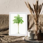 Vintage wall art of a green leaf with light yellowish-white patterns on a white background in a white frame. displayed on the wall