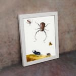 Infidu vintage wall art featuring detailed insects, including a beetle, butterfly, and smaller bugs, set against an off-white background with a touch of wild landscape. displayed on the wall art in a white frame
