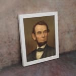 Infidu vintage wall decor featuring a classic portrait of a man with soft, earthy tones and a timeless appeal. displayed on the wall art in a white frame