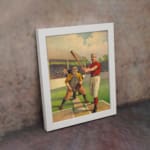 Infidu vintage wall art featuring a classic baseball scene with a batter, catcher, and judge in period uniforms on a vibrant field. displayed on the wall in a white frame