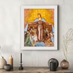 Vintage wall art of the Virgin Mary protecting people under her cloak in earthy tones. displayed on the wall