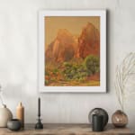 Infidu Rustic Mountain Scene vintage wall art showing mountains with reddish-brown cliffs, green trees, and a golden-yellow sky. displayed on the wall