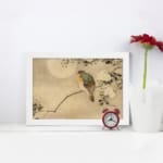 Infidu vintage wall art featuring a delicate bird perched on a branch with small leaves against a soft, neutral background. displayed on the wall art in a white frame