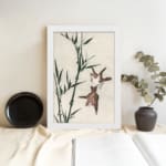 Infidu vintage wall art with two birds flying near bamboo in soft tones. displayed on the wall